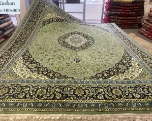 second hand sage green Kashan rug
